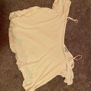 A white off the shoulder T-shirt with straps